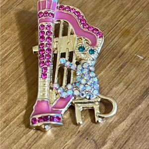 Cat brooch playing the harp with pink/abalone/green eyes on gold tone 1 3/4”
